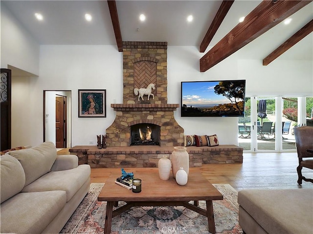 3 Poppy Trl, Rolling Hills, CA 90274 - living room with recessed lighting, beamed ceiling, a stone fireplace, and wood finished floors