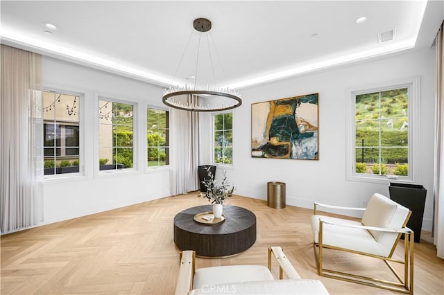 sitting room with recessed lighting, a tray ceiling, a chandelier, and visible vents