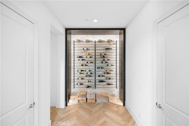 wine room featuring recessed lighting and baseboards