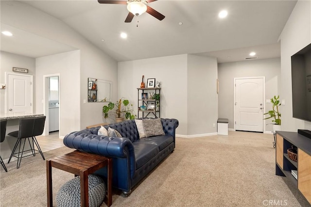 living room with baseboards, recessed lighting, light carpet, and ceiling fan