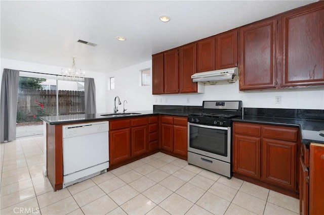 kitchen with a sink, visible vents, white dishwasher, gas range, and under cabinet range hood