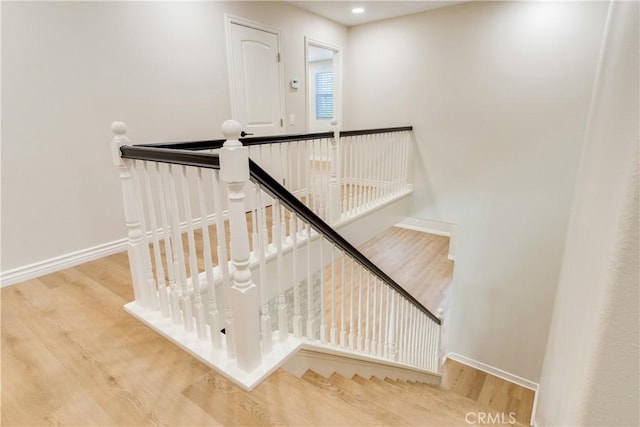 33827 Flora Springs St, Temecula, CA 92592 - staircase with wood finished floors and recessed lighting