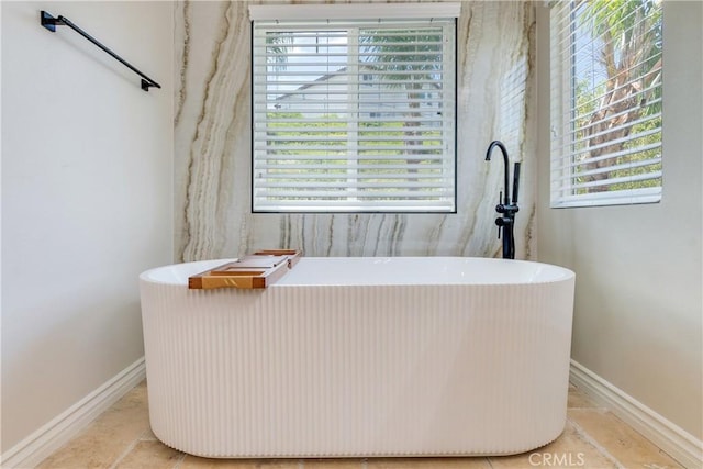 33827 Flora Springs St, Temecula, CA 92592 - full bathroom with a freestanding tub and baseboards