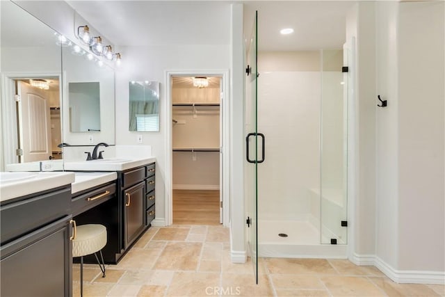 33827 Flora Springs St, Temecula, CA 92592 - bathroom featuring a shower stall, double vanity, and a spacious closet