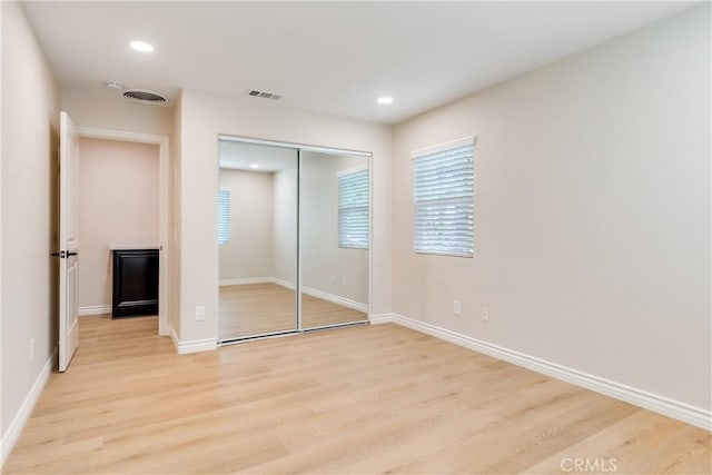 33827 Flora Springs St, Temecula, CA 92592 - unfurnished bedroom with light wood finished floors, a closet, and recessed lighting
