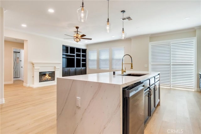 33827 Flora Springs St, Temecula, CA 92592 - kitchen featuring stainless steel dishwasher, hanging light fixtures, light wood finished floors, ceiling fan, and recessed lighting