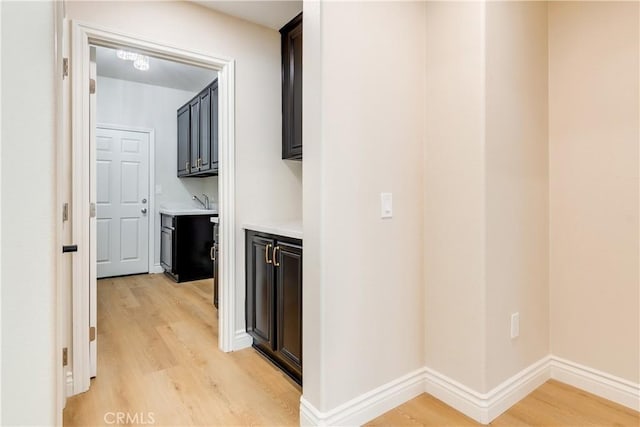 33827 Flora Springs St, Temecula, CA 92592 - hallway with light wood-type flooring and baseboards