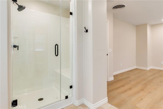 33827 Flora Springs St, Temecula, CA 92592 - full bathroom featuring a shower stall and wood finished floors