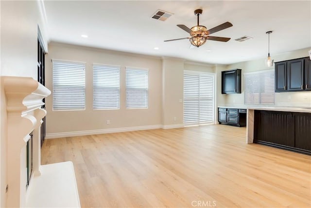 33827 Flora Springs St, Temecula, CA 92592 - unfurnished living room featuring light wood-style flooring, ceiling fan, crown molding, and recessed lighting