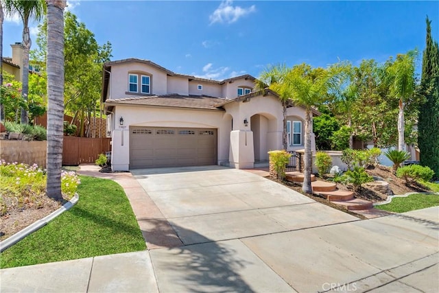 33827 Flora Springs St, Temecula, CA 92592 - mediterranean / spanish house with stucco siding, driveway, a garage, and a tile roof