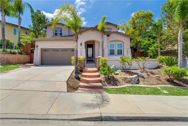 33827 Flora Springs St, Temecula, CA 92592 - mediterranean / spanish-style house featuring stucco siding, driveway, and a garage