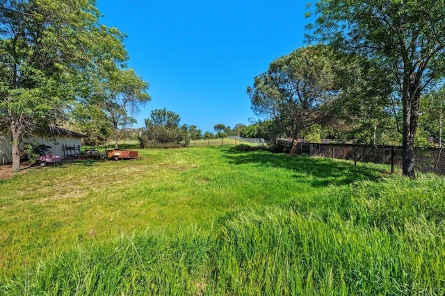 view of yard featuring fence