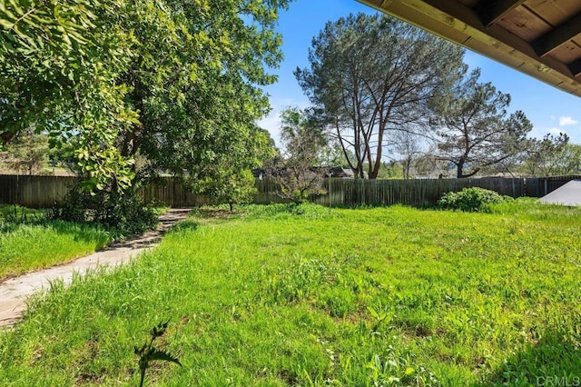 view of yard featuring a fenced backyard