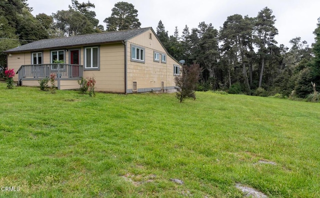 exterior space featuring a deck and a front yard