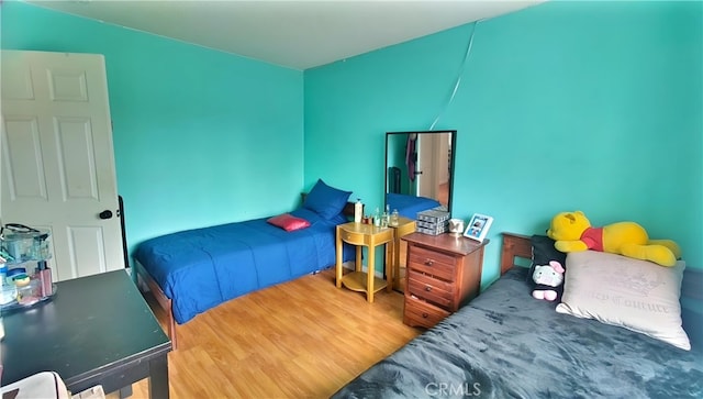bedroom featuring wood finished floors