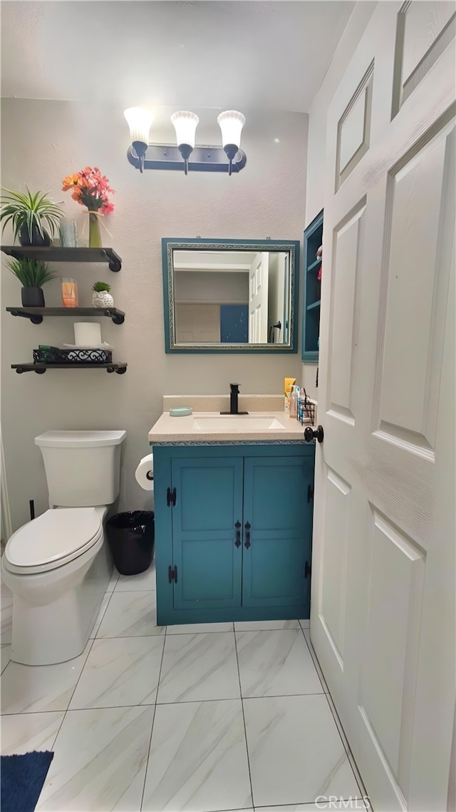 11622 Remington St, Sylmar, CA 91342 - half bath featuring toilet, vanity, and marble look tile flooring