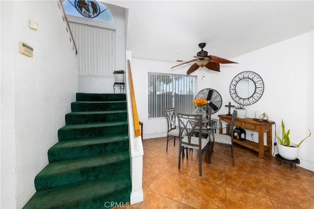 interior space with tile patterned flooring and ceiling fan