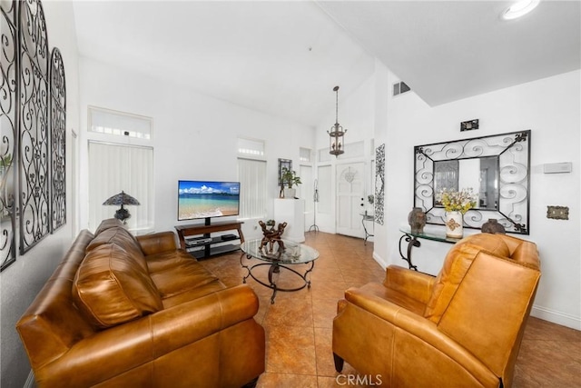 living room with high vaulted ceiling, baseboards, tile patterned floors, and visible vents