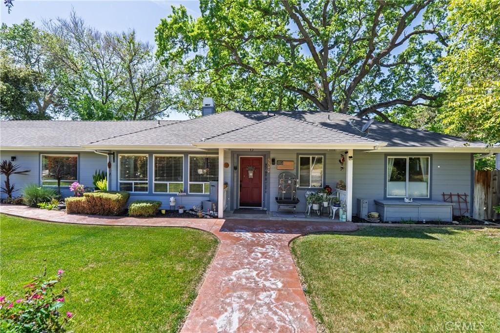 5540 Capistrano Ave, Atascadero, CA 93422 - ranch-style home with a front lawn, a shingled roof, covered porch, and fence