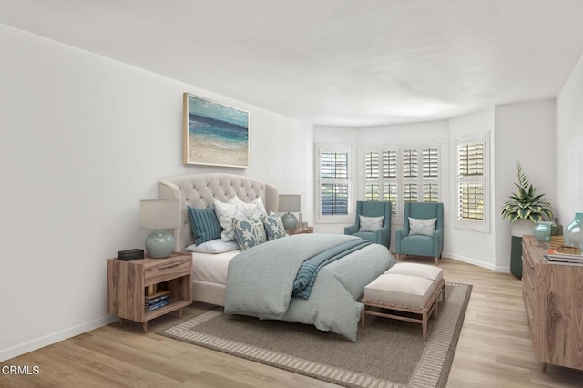 bedroom featuring baseboards and light wood-style floors