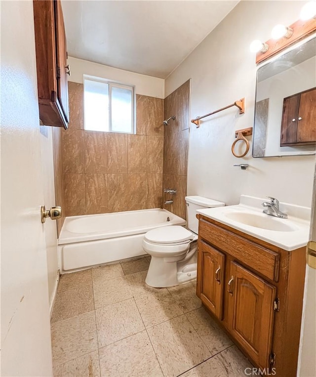 bathroom with toilet, shower / bathing tub combination, and vanity