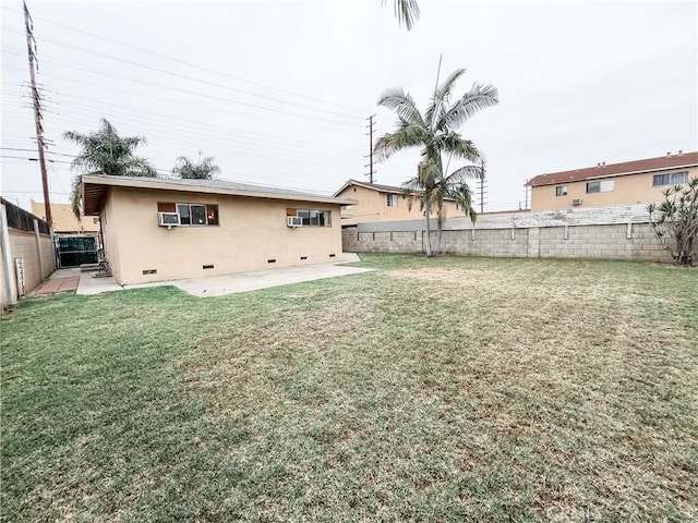 view of yard with a patio and a fenced backyard