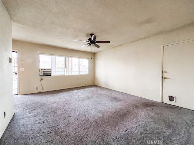 spare room featuring plenty of natural light, carpet flooring, a textured ceiling, and ceiling fan