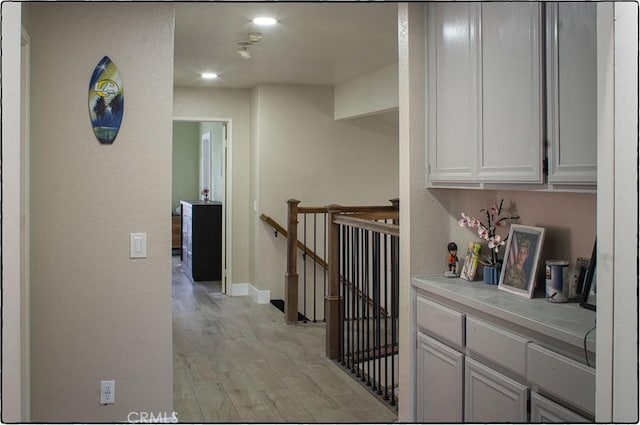 10075 Desert Mallow, Moreno Valley, CA 92557 - hall featuring an upstairs landing and light wood-type flooring