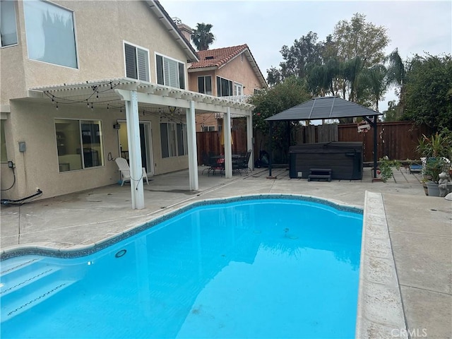 10075 Desert Mallow, Moreno Valley, CA 92557 - view of pool with a hot tub, a pergola, a fenced backyard, and a patio