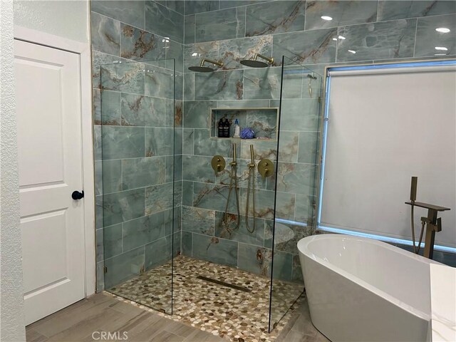 10075 Desert Mallow, Moreno Valley, CA 92557 - bathroom with a soaking tub, wood finished floors, and walk in shower