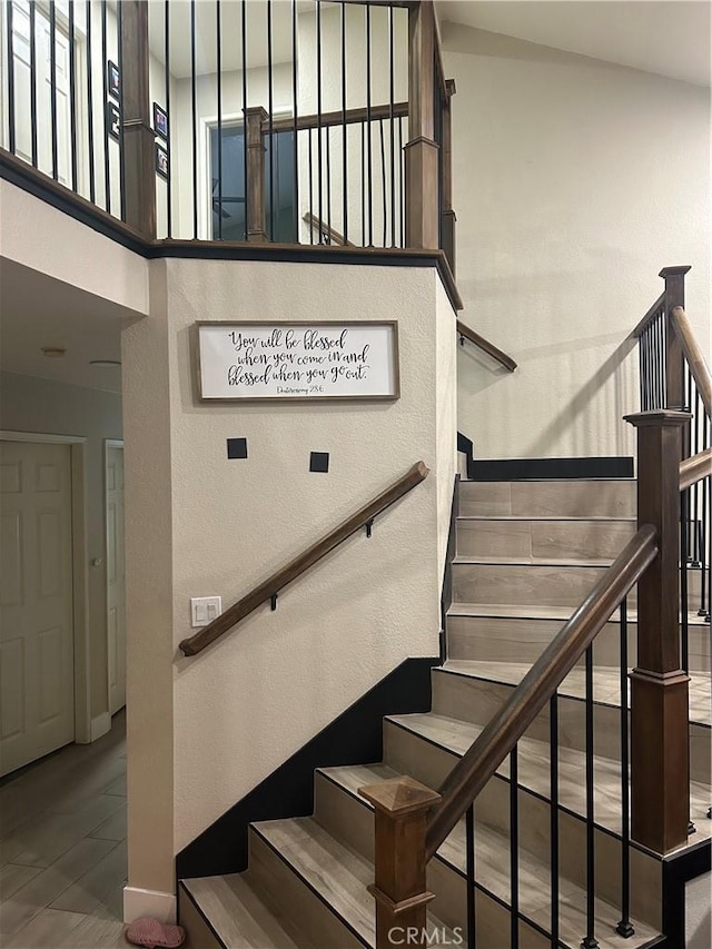 10075 Desert Mallow, Moreno Valley, CA 92557 - stairway featuring baseboards and a textured wall
