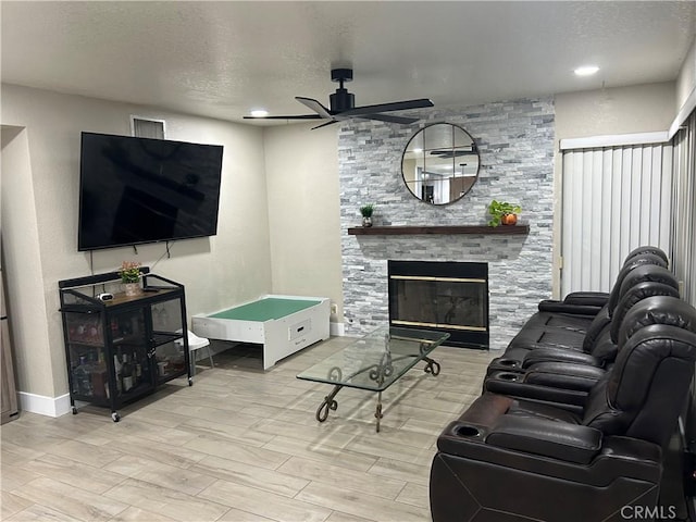 10075 Desert Mallow, Moreno Valley, CA 92557 - living area featuring a fireplace, ceiling fan, a textured ceiling, and wood finished floors