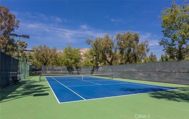 10075 Desert Mallow, Moreno Valley, CA 92557 - view of tennis court featuring fence