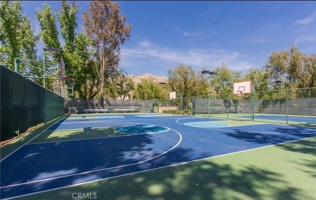 10075 Desert Mallow, Moreno Valley, CA 92557 - view of sport court featuring community basketball court and fence
