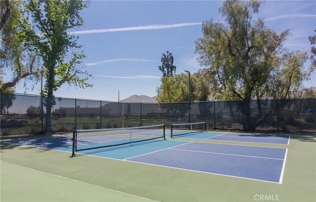 10075 Desert Mallow, Moreno Valley, CA 92557 - view of tennis court with fence and community basketball court