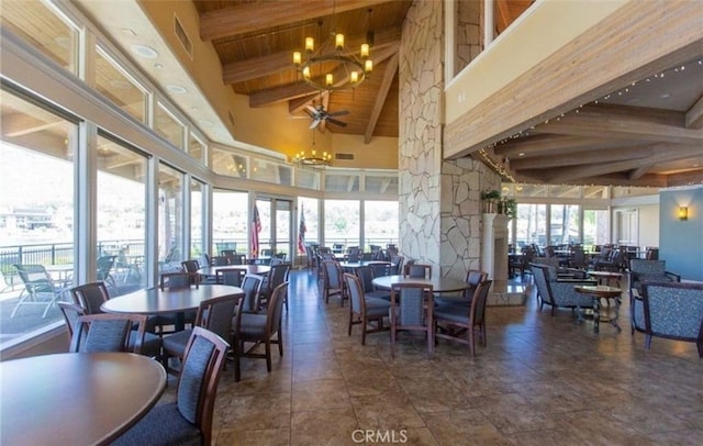 10075 Desert Mallow, Moreno Valley, CA 92557 - dining area with a chandelier, beam ceiling, plenty of natural light, a high ceiling, and ornate columns