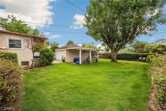 view of yard with an outdoor structure and fence