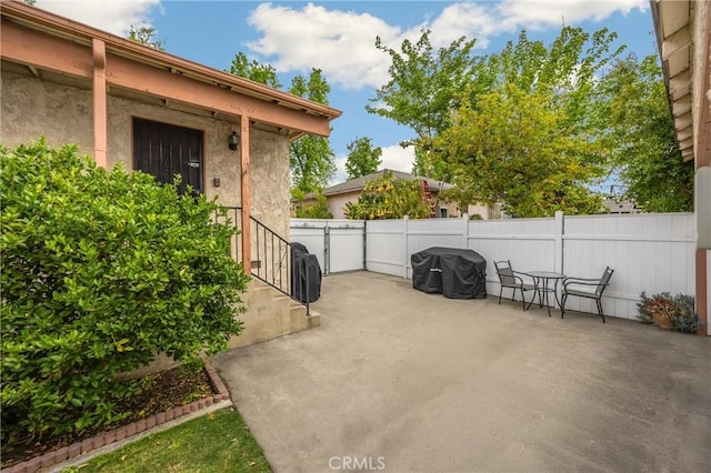 view of patio / terrace featuring fence
