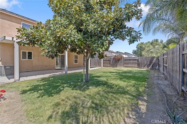 view of yard featuring a patio and a fenced backyard