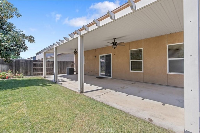 exterior space featuring fence, ceiling fan, cooling unit, and a patio area