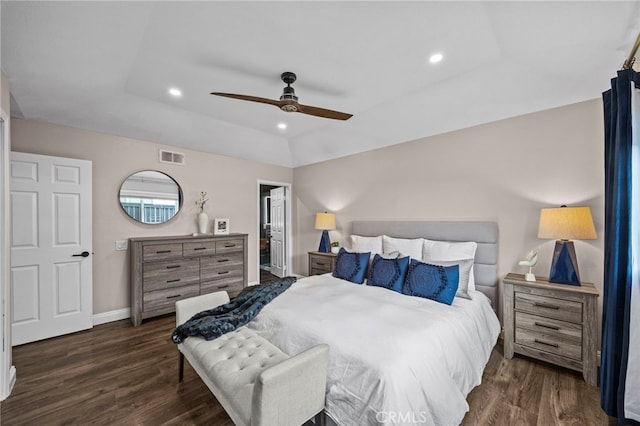 bedroom featuring recessed lighting, visible vents, wood finished floors, and a tray ceiling