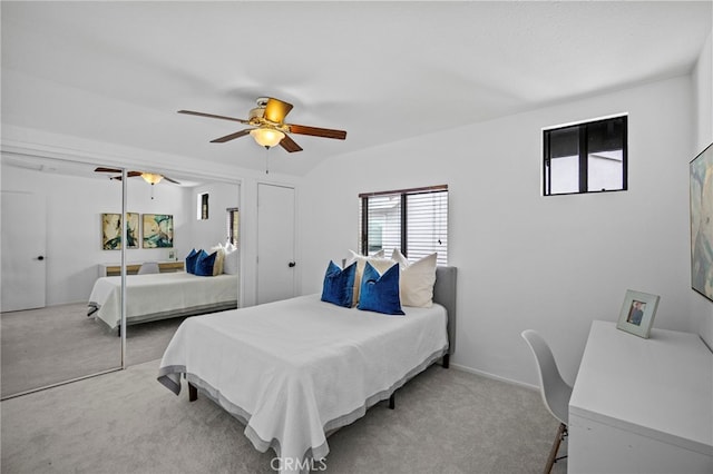 bedroom featuring ceiling fan, a closet, and carpet floors