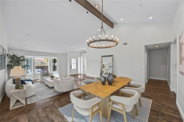 dining room with lofted ceiling with beams, a notable chandelier, visible vents, and wood finished floors