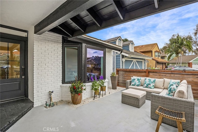 view of patio with fence and an outdoor hangout area