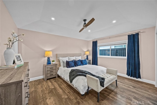 bedroom featuring lofted ceiling, baseboards, dark wood-style flooring, recessed lighting, and a ceiling fan