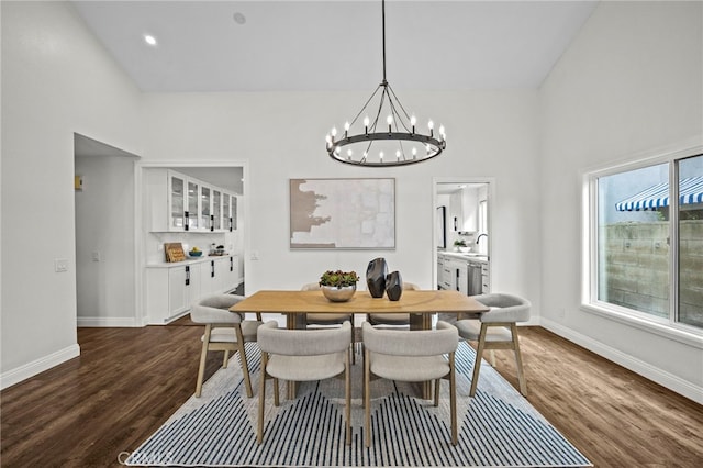 6 Crockett, Irvine, CA 92620 - dining room with dark wood-type flooring, a chandelier, baseboards, a high ceiling, and recessed lighting