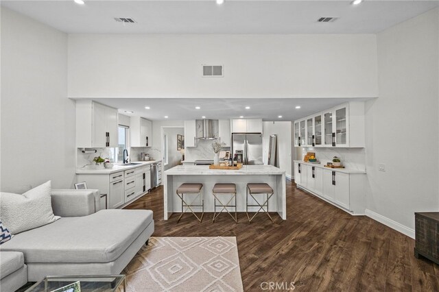 living room featuring visible vents and recessed lighting