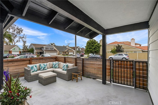 view of patio / terrace with an outdoor hangout area, a fenced backyard, and a residential view