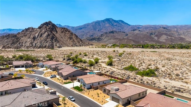 aerial view with a residential view, a mountain view, and a desert view