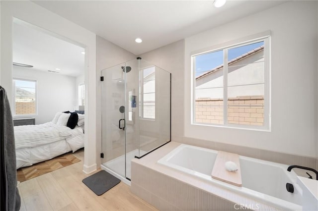 bathroom featuring ensuite bath, parquet floors, recessed lighting, a bath, and a stall shower